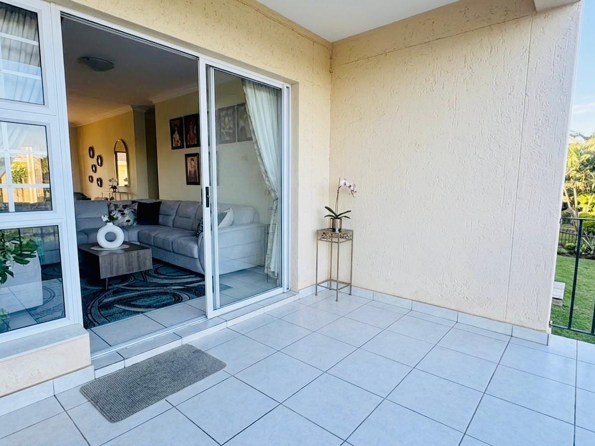 The tiled patio, with sliding doors back into the living room
